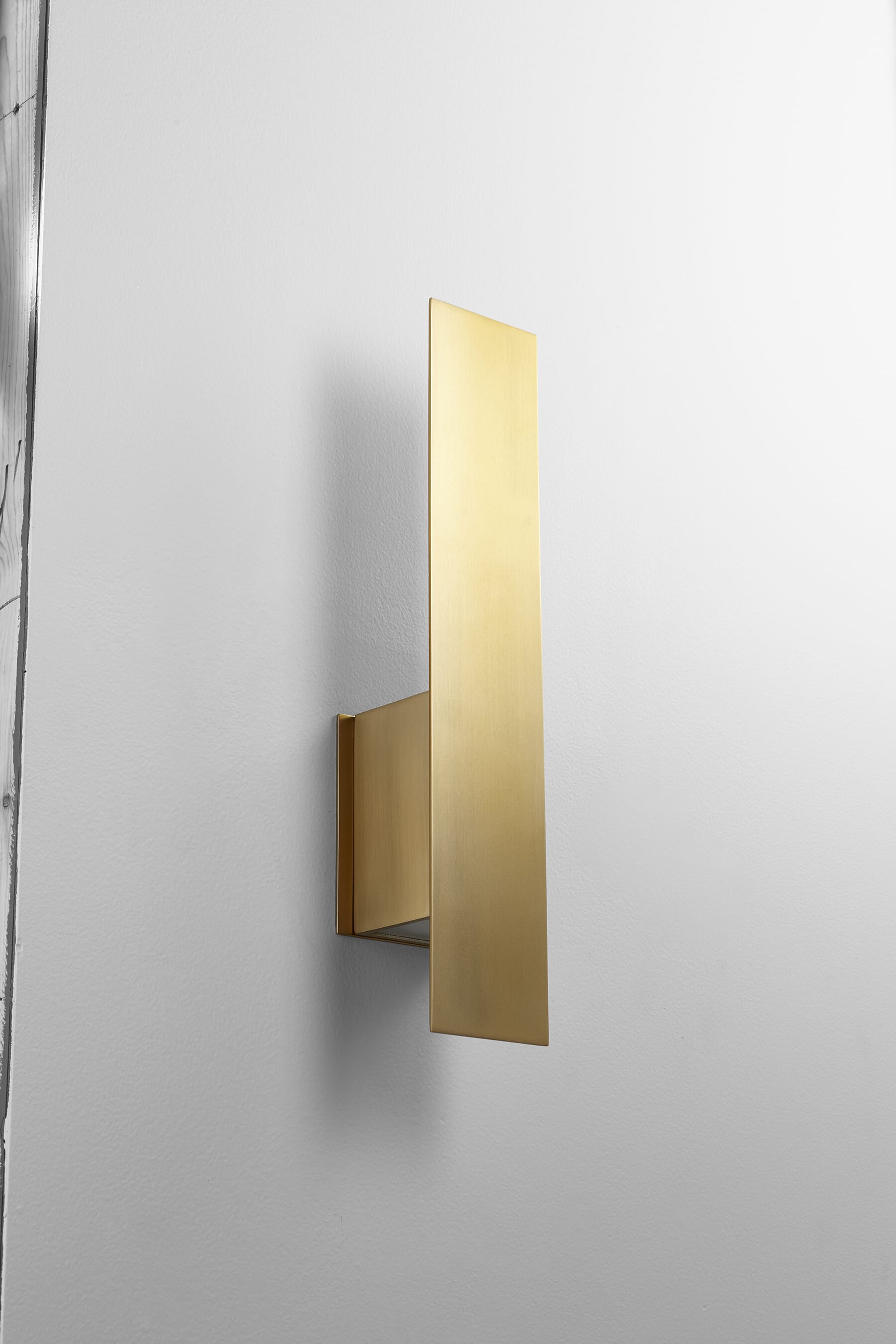 Oxygen Reflex Wall Sconce in Aged Brass